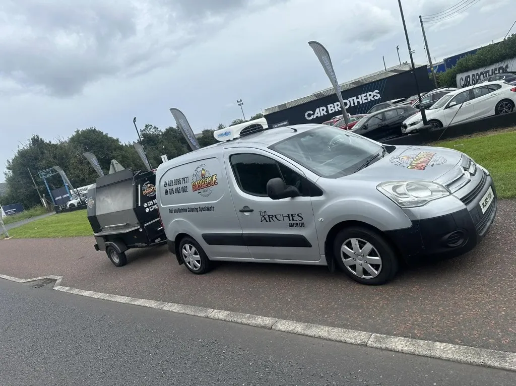 The Arches Cater Ltd van and BBQ trailer on site