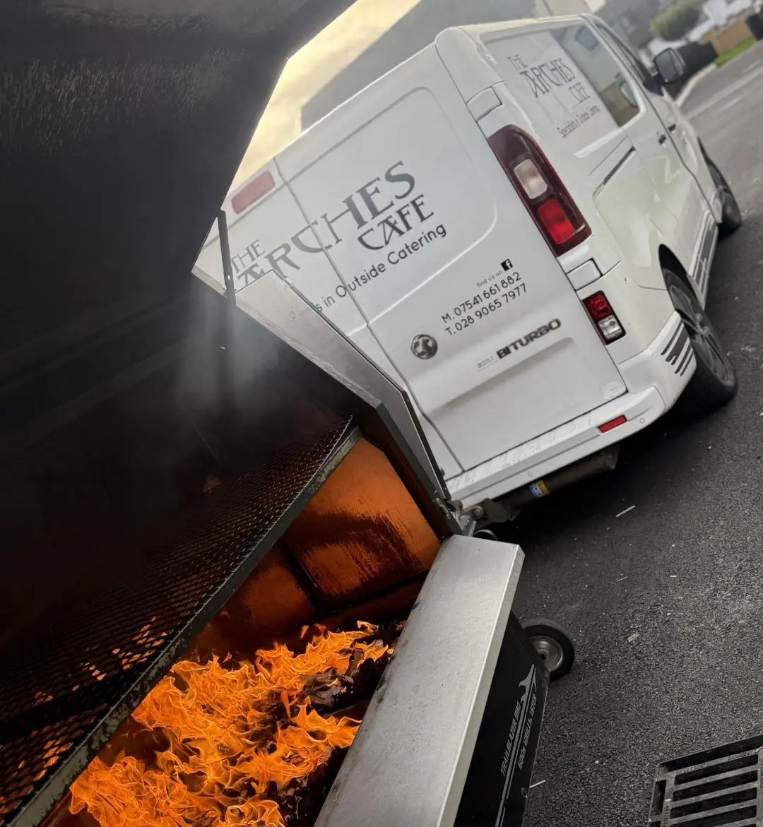 BBQ trailer firebox with roaring flames